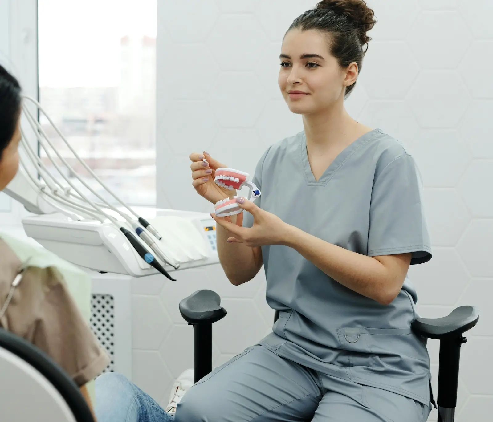 Friendly Hygienist working with a patient