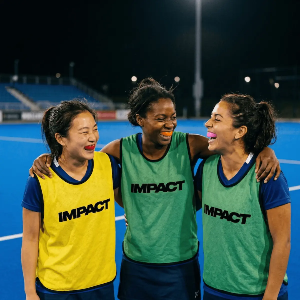 Hockey player wearing an IMPACT custom 3D-printed gumshield — available at Harmoni Dental Kingston
